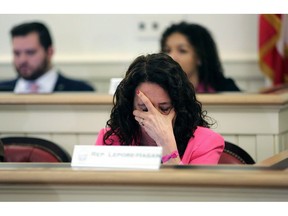 Ohio Representative Michele Lepore-Hagan wipes tears from her face during a hearing to propose amendments to the "Heartbeat Bill" which was later voted to pass through the committee and to the House floor at the Ohio Statehouse in Columbus, Ohio on Tuesday, April 9, 2019.