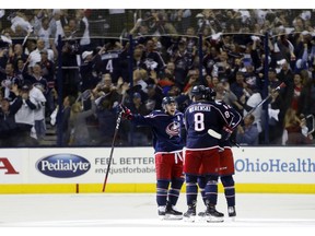 Columbus Blue Jackets players celebrate their goal against the Tampa Bay Lightning during the third period of Game 4 of an NHL hockey first-round playoff series, Tuesday, April 16, 2019, in Columbus, Ohio. The Blue Jackets beat the Lightning 7-3.