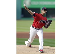 Cleveland Indians starting pitcher Carlos Carrasco delivers in the first inning of a baseball game against the Miami Marlins, Tuesday, April 23, 2019, in Cleveland.