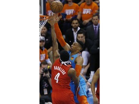 Oklahoma City Thunder guard Russell Westbrook (0) shoots as Portland Trail Blazers forward Maurice Harkless (4) defends in the first half of Game 3 of an NBA basketball first-round playoff series Friday, April 19, 2019, in Oklahoma City.