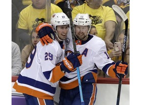 New York Islanders' Brock Nelson (29) celebrates his goal with Josh Bailey (12) during the first period in Game 4 of an NHL first-round hockey playoff series against the Pittsburgh Penguins in Pittsburgh, Tuesday, April 16, 2019.