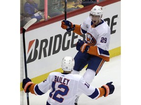 New York Islanders' Brock Nelson (29) celebrates his goal with Josh Bailey (12) during the first period in Game 3 of an NHL first-round hockey playoff series against the Pittsburgh Penguins in Pittsburgh, Sunday, April 14, 2019.