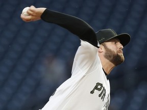 Pittsburgh Pirates starter Jordan Lyles pitches against the Cincinnati Reds during the first inning of a baseball game Thursday, April 4, 2019, in Pittsburgh.