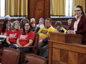 Mary Konieczny, right, addresses the City Council during a meeting regarding proposed gun restriction legislation, Tuesday, April 2, 2019, in Pittsburgh. The bill, introduced in the wake of the synagogue massacre last October, places restrictions on military-style assault weapons like the AR-15 rifle that authorities say was used in the attack that killed 11 and wounded seven. The council approved the measures 6-3 on Tuesday.