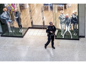 Responding to a call of shots fired, a Monroeville Police officer patrols the Monroeville Mall, Friday, April 12, 2019, in Monroeville, Pa.