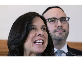 Montreal mayor Valerie Plante responds to a question as opposition leader Lionel Perez looks on during a news conference in Montreal on Monday, April 15, 2019.
