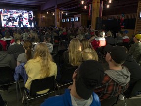 Fans crowd into a bar to watch the Lethbridge Hurricanes play the Calgary Hitmen in game seven WHL playoff action in Lethbridge, Alta. on Tuesday, April 2, 2019.