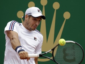 Serbia's Dusan Lajovic returns a ball to Italy's Fabio Fognini during the men's singles final match of the Monte Carlo Tennis Masters tournament in Monaco, Sunday, April, 21, 2019.