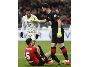 PSG's Neymar, left, argues with Rennes' goalkeeper Tomas Koubek, right, and Rennes' Rame Bensebaini, down,during the French Cup soccer final between Rennes and Paris Saint Germain at the Stade de France stadium in Saint-Denis, outside Paris, France, Saturday, April 27, 2019.