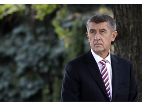 FILE - In this Oct. 26, 2018 file photo Czech Republic's Prime Minister Andrej Babis waits in front of his residency in Prague, Czech Republic. Czech police have completed their investigation of Prime Minister Andrej Babis over alleged fraud involving European Union subsidies and proposed he faces trial.  The Prague municipal prosecution said Wednesday, April 17, 2019 it has received the results' of the investigation into Babis' possible involvement in the $2 million fraud.