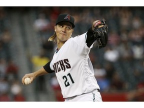Arizona Diamondbacks starting pitcher Zack Greinke throws to a Texas Rangers batter during the first inning of a baseball game Tuesday, April 9, 2019, in Phoenix.