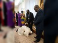 Pope Francis (Bottom) on April 11, 2019  kneels to kiss the feet of South Sudan's President Salva Kiir Mayardit (C) and South Sudan opposition leader Riek Machar (R) at the Pope's Santa Marta residence in the Vatican.