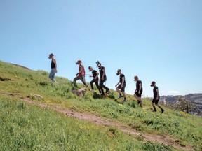 The Fog City Pack, a four-year-old group of nine people who practice puppy play, on Tank Hill in San Francisco, March 30, 2018.