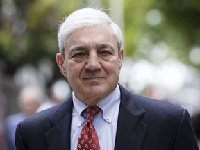 FILE - In this June 2, 2017, file photo, former Penn State President Graham Spanier departs after his sentencing hearing at the Dauphin County Courthouse in Harrisburg, Pa. A federal judge on Tuesday, April 30, 2019 has thrown out Spanier's child-endangerment conviction, less than a day before he was due to turn himself in to jail.
