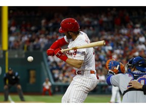 Philadelphia Phillies' Bryce Harper is hit by a pitch from New York Mets' Steven Matz during the first inning of a baseball game, Tuesday, April 16, 2019, in Philadelphia.