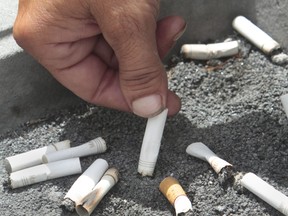 A smoker puts out a cigarette.