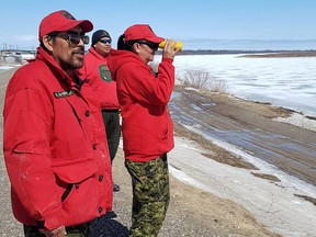 Canadian Rangers monitor the ice and water levels on the Albany River at Kashechewan.