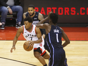 Toronto Raptors Kyle Lowry PG (7) breaking past Orlando Magic Jonathan Isaac PF (1) during the first half in Toronto, Ont. on April 23, 2019.