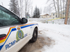 An RCMP cruiser sits parked near a murder scene in La Loche, Saskatchewan. The force appears to have no plans to drop its contract policing services — which span eight provinces, three territories and 150 municipalities — anytime soon.
