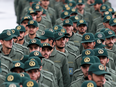 Iranian Revolutionary Guard members arrive for a ceremony celebrating the 40th anniversary of the Islamic Revolution in Tehran, Feb, 11, 2019.