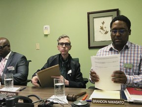 Alaska Human Rights Commission members Marcus Sanders, left, David Barton, middle, and chairman Brandon Nakasato are shown at the conclusion of a commission meeting Monday, April 1, 2019, in Anchorage, Alaska. The commission went into executive session for nearly three hours but recessed when it could not come to a conclusion on the fate of Marti Buscaglia, its executive director after Alaska Gov. Mike Dunleavy requested an investigation following her social media complaint about a pickup parked in the commission's lot that had a "Black Rifles Matter" sticker.