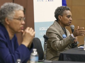In this March 24, 2019 photo, Chicago mayoral candidate Lori Lightfoot, right, participates in a candidate forum in Chicago. Lightfoot and Toni Preckwinkle, left, are competing to make history by becoming the city's first black, female mayor. On issues their positions are similar. But their resumes are not, and that may make all the difference when voters pick a new mayor on Tuesday, April 2, 2019.