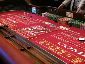 This Feb. 22, 2019 photo shows a craps game underway at the Golden Nugget casino in Atlantic City, N.J. Figures released on Monday, April 8, show that gross operating profits for Atlantic City casinos declined by more than 15 percent in 2018 as two shuttered casinos reopened, adding to the competition for existing casinos.