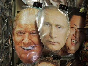Face masks depicting, from left, U.S. President Donald Trump, Russian President Vladimir Putin and North Korean leader Kim Jong Un displayed for sale at a street souvenir shop in St.Petersburg, Russia, Monday, Sept. 25, 2017.