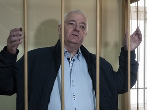 In this Monday, Oct. 1, 2018 file photo, Norwegian national Frode Berg, who was accused of spying on Russia, stands in a cage in Lefortovo district court in Moscow, Russia.