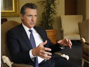 Gov. Gavin Newsom speaks during an interview with The Associated Press, Monday, April 15, 2019, in Sacramento, Calif. Newsom and California lawmakers are looking for ways to guard Californians against the growing threats from wildfires.