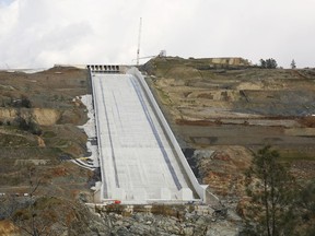 This Feb. 20, 2019, photo shows the Oroville Dam spillway in Oroville, Calif. California officials say the flood-control spillway at the nation's tallest dam is expected to be deployed as early as Tuesday, April 2, 2019, for the first time since it was rebuilt after it crumbled during heavy rains two years earlier, forcing nearly 2000,000 people to evacuate.