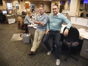 In this April 9, 2019, photo, Argus Leader investigative reporter Jonathan Ellis and news director Cory Myers in the newsroom in Sioux Falls, S.D. In 2010, reporters at South Dakota's Argus Leader newspaper came up with the idea of requesting data about the government's food assistance program. They thought the information about the $65-billion dollar-a year program, previously known as food stamps, could lead to a series of stories and help them identify possible fraud. But the government didn't provide everything the paper wanted. Trying to get the data has taken the paper more than eight years and landed the case at the Supreme Court.