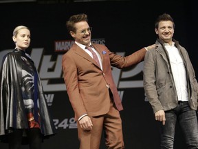 Actor Robert Downey Jr., center, poses with actor Jeremy Renner, and actress Brie Larson during an Asia Press Conference to promote their latest film "Avengers Endgame" in Seoul, South Korea, Monday, April 15, 2019. The movie will open on April 24 in South Korea.