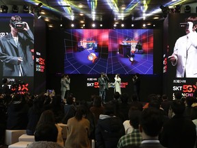 Participants wear VR devices for an audio-visual experience during a media showcase for 5G service of SK Telecom in Seoul, South Korea, Wednesday, April 3, 2019. SK Telecom will be launching commercial 5G services nationwide across South Korea on Friday, April 5, in line with its competitors.
