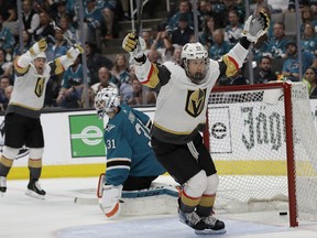 Vegas Golden Knights center Cody Eakin, foreground, celebrates after scoring a goal in front of San Jose Sharks goaltender Martin Jones, center, during the second period of Game 7 of an NHL hockey first-round playoff series in San Jose, Calif., Tuesday, April 23, 2019.