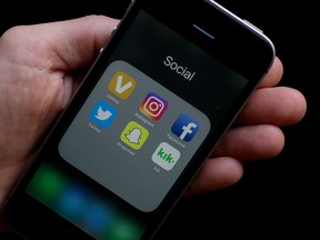 Social media app icons are shown on a smartphone in San Francisco, June 16, 2017.