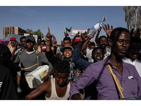 Demonstrators rally near the military headquarters in Khartoum, Sudan, Monday, April 15, 2019. The Sudanese protest movement on Monday welcomed the "positive steps" taken by the ruling military council, which held talks over the weekend with the opposition leaders and released some political prisoners. The praise came despite a brief incident earlier Monday where activists said soldiers attempted to disperse the ongoing protest sit-in outside the military headquarters in the capital, Khartoum, but eventually backed off.
