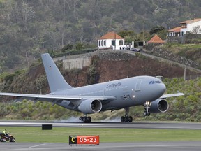 A German air force (Luftwaffe) plane lands at Madeira international airport in Funchal, the capital of Portugal's Madeira Island, Saturday April 20, 2019. A German plane is due to take home some of the injured survivors in Wednesday's bus crash in Madeira.