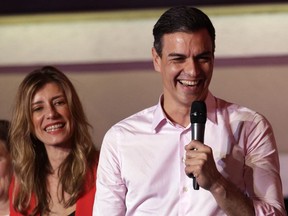Spanish Prime Minister and Socialist Party candidate Pedro Sanchez speaks to supporters gathered at the party headquarters waiting for results of the general election in Madrid, Sunday, April 28, 2019. Spain's governing Socialists won the country's national election Sunday but will need the backing of smaller parties to stay in power, while a far-right party rode a groundswell of support to enter the lower house of parliament for the first time in four decades, provisional results showed. At left is his wife Maria Begona Gomez.