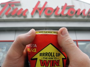 Tim Hortons says a weak roll-up-the-rim campaign contributed to the sales falling 0.6 per cent worldwide and 0.4 per cent in Canada.