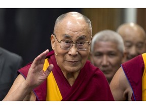 FILE - In this Sept. 15, 2018, file photo, Tibetan spiritual leader the Dalai Lama greets journalists during the opening of the exhibition titled "Buddha's Life" at the Nieuwe Kerk church in Amsterdam, Netherlands. The Dalai Lama has been hospitalised in the Indian capital with chest infection and is feeling much better. The Tibetan spiritual leader's spokesman Tenzin Taklha says the Dalai Lama is under medication and likely to spend a day or two in the hospital. The Dalai Lama flew to New Delhi from Dharmsala for consultations with doctors and was hospitaliszd on Tuesday, April 9, 2019.