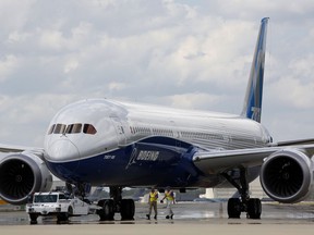 FILE - In this March 31, 2017, file photo, Boeing employees walk the new Boeing 787-10 Dreamliner down towards the delivery ramp area at the company's facility in South Carolina after conducting its first test flight at Charleston International Airport in North Charleston, S.C. Singapore Airlines says it has grounded two of its Boeing 787-10 aircraft due to engine issues. The carrier in a statement on Tuesday, April 2, 2019, that "premature blade deterioration was found on some engines" of its 787-10 fleet at recent routine inspections.
