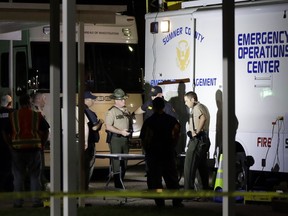 Law enforcement officials work at a command center set up at North Sumner Elementary School Saturday, April 27, 2019, in Bethpage, Tenn. Authorities in rural Tennessee captured a suspect Saturday during a manhunt that was prompted by the discovery of several bodies in two homes.