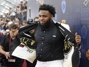Clemson defensive tackle Christian Wilkins walks the red carpet ahead of the first round at the NFL football draft, Thursday, April 25, 2019, in Nashville, Tenn.