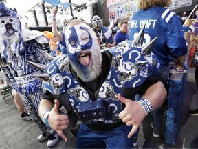 A Indianapolis Colts fan cheers ahead of the first round at the NFL football draft, Thursday, April 25, 2019, in Nashville, Tenn.
