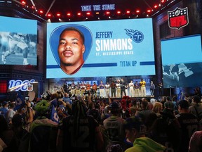 Tennessee high school football players join NFL Commissioner Roger Goodell as Goodell announces that the Tennessee Titans selected Mississippi State's Jeffery Simmons during the first round at the NFL football draft, Thursday, April 25, 2019, in Nashville, Tenn.