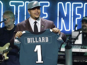 Washington State tackle Andre Dillard shows off his new jersey after the Philadelphia Eagles selected him in the first round at the NFL football draft, Thursday, April 25, 2019, in Nashville, Tenn.