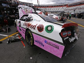 The car of driver Tyler Reddick sits in the pits being worked on after practice for the NASCAR Xfinity Series auto race Friday, April 5, 2019, in Bristol, Tenn. The reigning Xfinity Series champion is piloting a Chevrolet at Bristol covered with country music icon Dolly Parton's face and her signature butterfly logo.