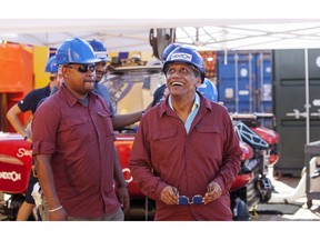 In this Saturday, April 13 2019, photo, Seychelles President Danny Faure, right, tours the vessel on which researchers from a British-led science expedition are currently exploring the waters of the vast island nation, off the coast of Desroches, in the outer islands of Seychelles. Faure toured the vessel and was presented with some of the findings and observations made so far by the research team.