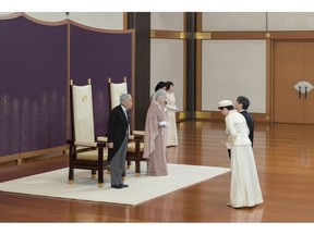 In this photo provided by the Imperial Household Agency, Japan's Emperor Akihito, left, and Empress Michiko, second from left, are greeted by Crown Prince Naruhito, right, and Crown Princess Masako second from right, as they celebrate their 60th wedding anniversary at the Imperial Palace in Tokyo, Wednesday, April 10, 2019. (The Imperial Household Agency of Japan via AP)